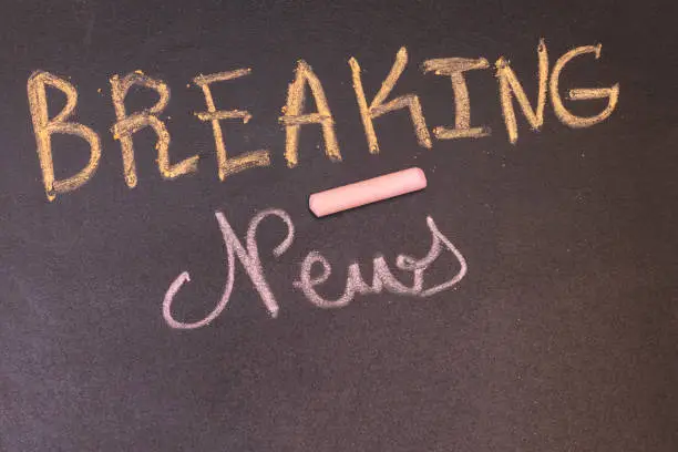Photo of handwriting Breaking News Concept on  Chalkboard with colorful chalk