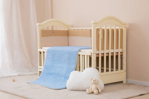 istock White children's beds, blue mattresses 1130103120