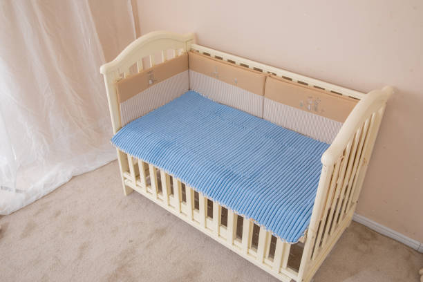 istock White children's beds, blue mattresses 1130103122