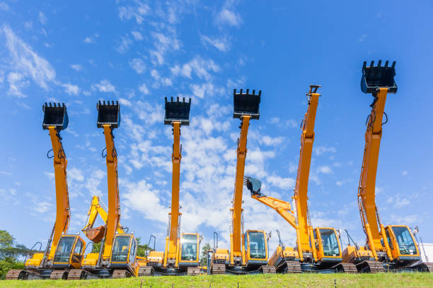 istock New Excavators Earth Mover Machines Blue Sky 1130103226