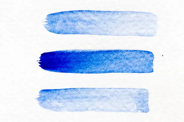 Blue color watercolor handdrawing as line brush on white paper background