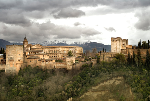 View of Alhambra from San Nicolas in the Albaicin area in Granada, Spain, and in the back Sierra Nevada