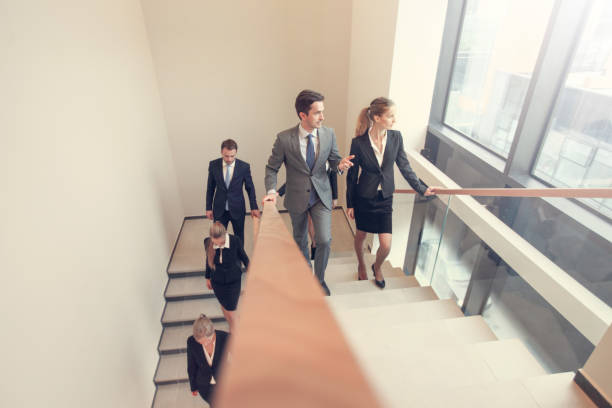 istock Business people walking the stairs 1130107704