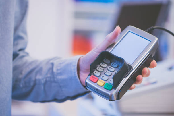 istock Payment terminal in a shop, paying by card 1130109245