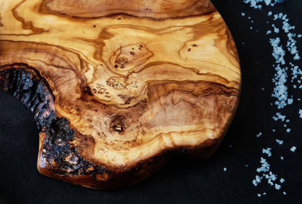 istock Cooking background with natural wooden cutting board, top view 1130110266