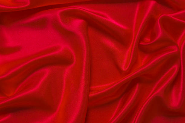 istock An abstract backdrop or liquid wave or folded notches of silk, grunge, satin, Christmas background. 1130110704
