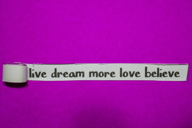 Live Dream More Love Believe, Inspiration, Motivation and business concept on purple torn paper
