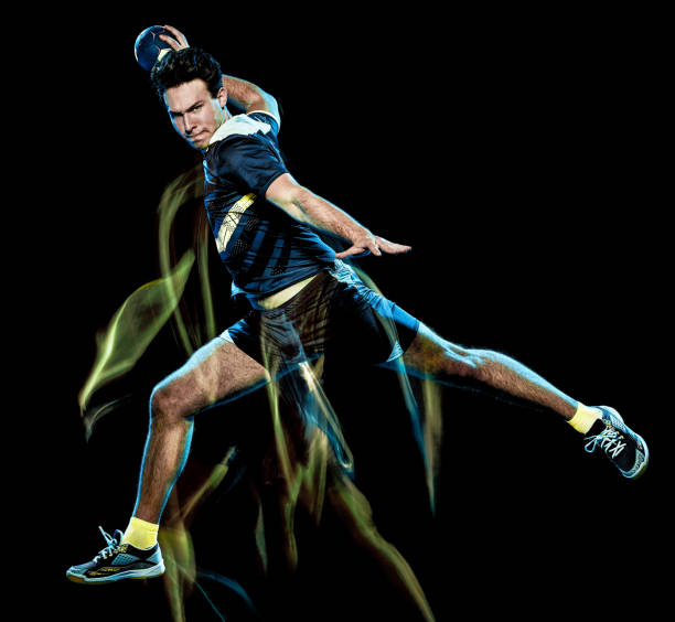 istock handball player young man isolated speed light painting 1130116375