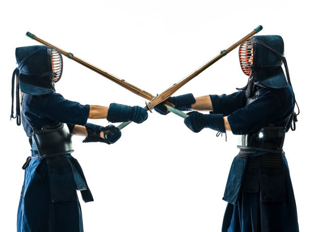 istock Kendo martial arts fighters silhouette isolated white bacground 1130116396
