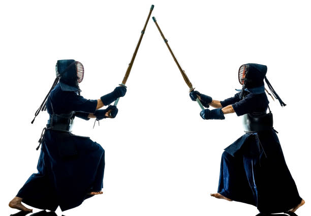 istock Kendo martial arts fighters silhouette isolated white bacground 1130116886