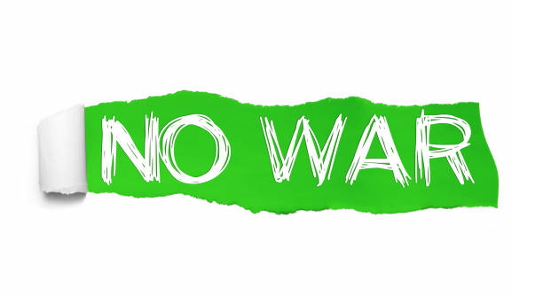 istock NO WAR written under the curled piece of Green torn paper 1130116962