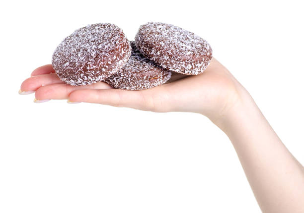 istock cookies with chocolate coconut marshmallow in hand 1130117364