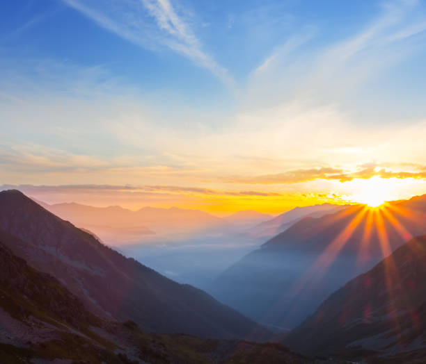 istock quiet mountain valley in a clouds at the sunrise 1130119477