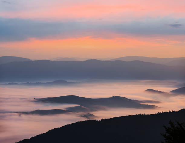 istock quiet mountain valley in a blue mist at the dawn 1130119499