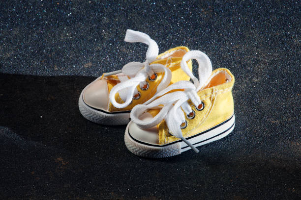 istock yellow sneakers skateboard background 1130119570