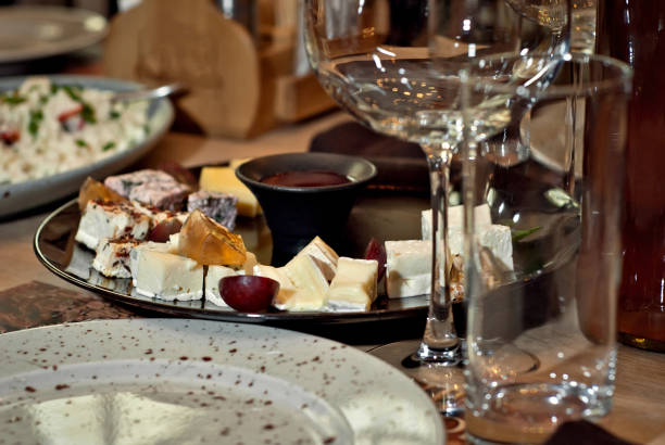 istock Delicious dishes on the table in the restaurant. serving table. Different kinds of cheese with honey on a plate. 1130120134