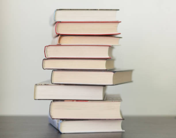 istock a stack of different books in a thick cover on the table 1130120222