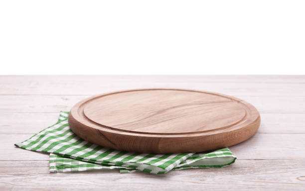 istock Pizza board, with napkin on wooden table isolated. Top view mockup 1130120286