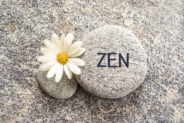 istock Word zen written on a stone background with a daisy 1130120786