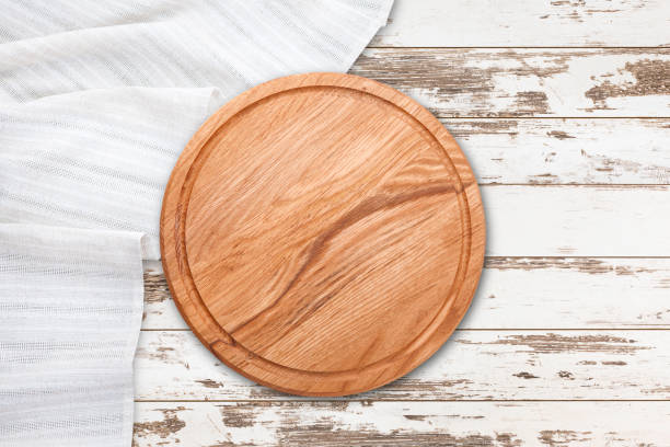 istock Table cloth and pizza board on vintage wooden table. Top view mockup 1130122588
