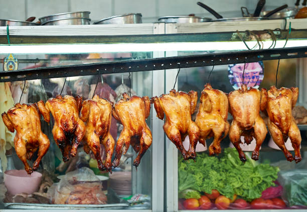 istock Whole grilled chicken hanging in line 1130122909