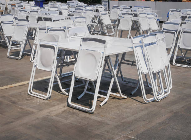 istock Groups of White Collapsible Chairs and Tables for the Event 1130123001