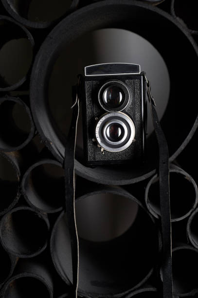 istock Love for photography, creativity. Camera on black abstract background. Learning photography 1130125247