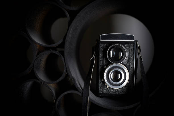 istock Love for photography, creativity. Camera on black abstract background. Learning photography 1130125309