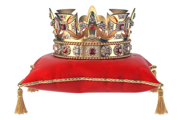 golden crown with jewels on red velvet pillow for coronation isolated on white. - red crowned imagens e fotografias de stock