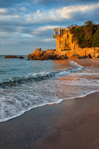 Sunrise at Sea in Nerja on Costa del Sol in Spain Sunrise in Nerja on Costa del Sol in Spain, sea shore and Balcon de Europa. nerja stock pictures, royalty-free photos & images