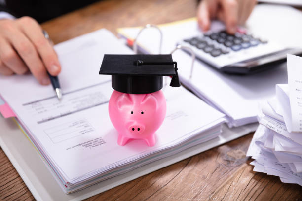 istock Pink Piggybank With Graduation Hat On Folder 1130134888