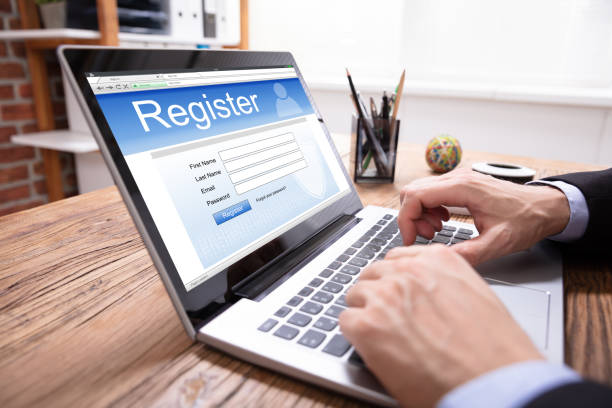 istock Man Filing Online Registration Form On Laptop 1130134912