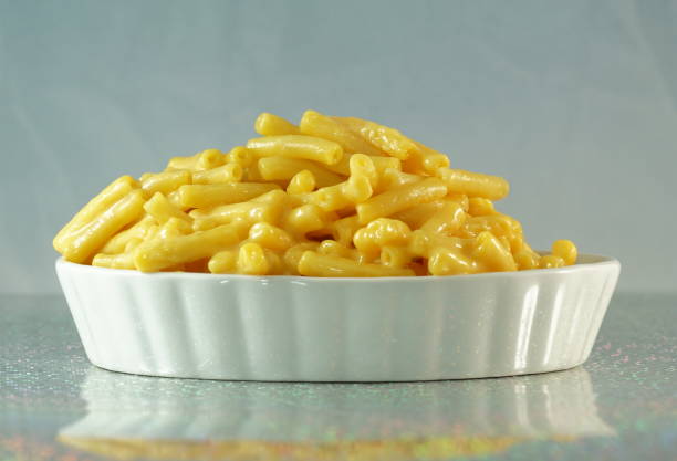 istock Creamy macaroni and cheese in a white fancy dish on a mirror 1130138008