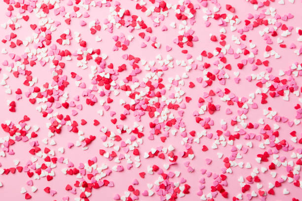 istock Sugar hearts on pink background. Romantic, St Valentines day concept. Top view. 1130138508