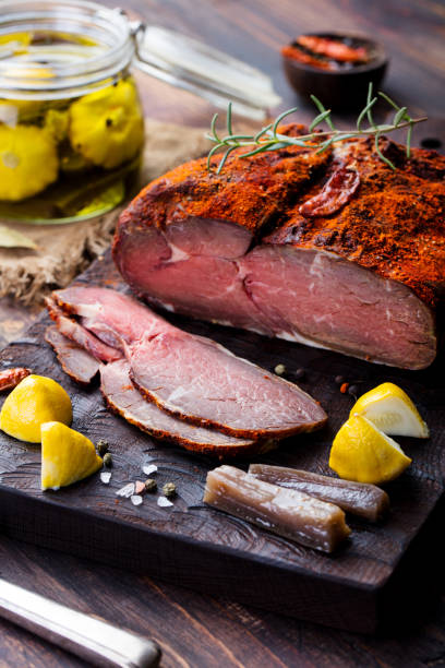 istock Roasted beef, pastrami on cutting board. Wooden background. 1130138586