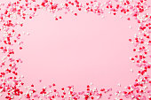 Sugar hearts frame on pink background. Romantic, St Valentines day concept. Top view. Copy space.