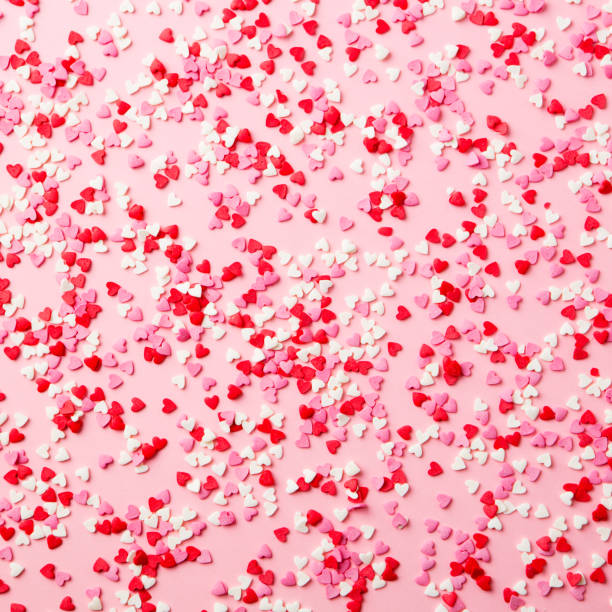 istock Sugar hearts on pink background. Romantic, St Valentines day concept. Top view. 1130140509