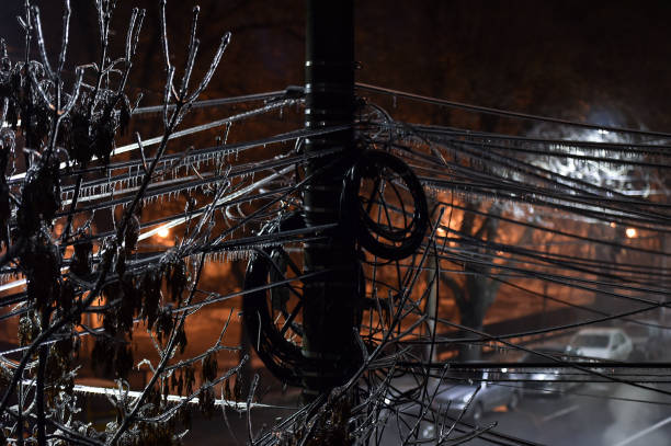 Electricity cables covered in ice after frozen rain phenomenon