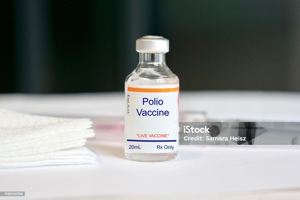 Polio Vaccine in a glass vial Concept of a vaccine/immunization, fake label Polio Vaccine Stock Photo