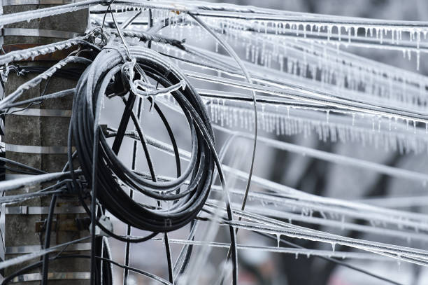 istock Electricity cables covered in ice after frozen rain phenomenon 1130140974
