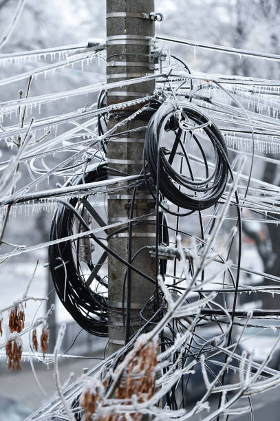 istock Electricity cables covered in ice after frozen rain phenomenon 1130140993