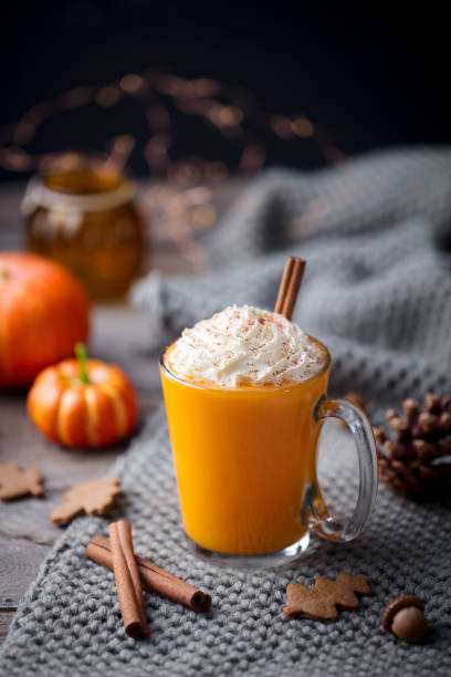 istock Pumpkin latte with spices. Boozy cocktail with whipped cream. Grey background. Copy space. 1130141734