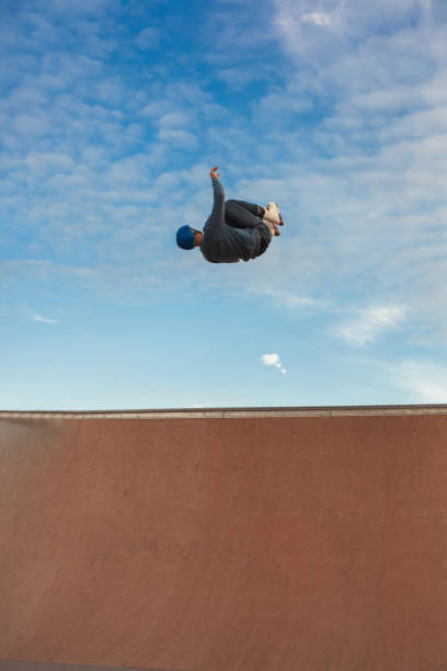 istock Young man jump from ramp with roller skate 1130144863