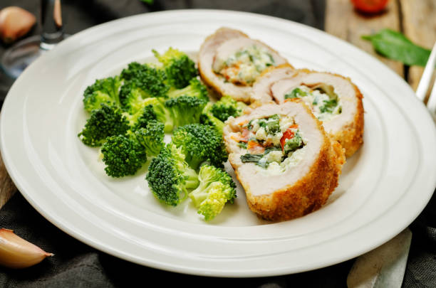istock Ricotta tomato spinach stuffed turkey with broccoli 1130145809