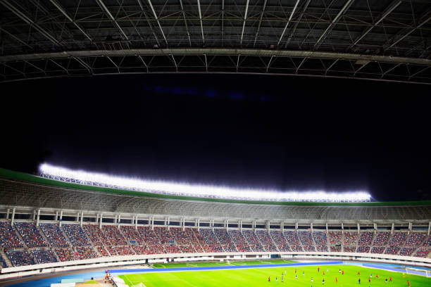istock Soccer game in a stadium at night 1130149081