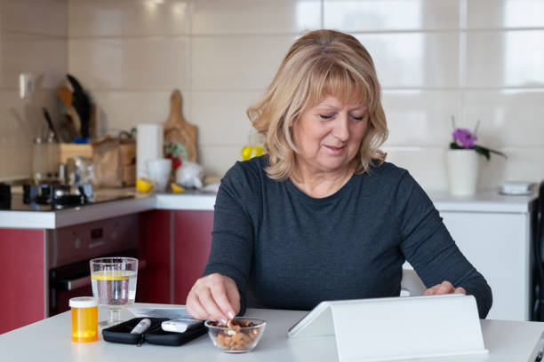 Senior diabetic woman preparing a breakfast  at home
