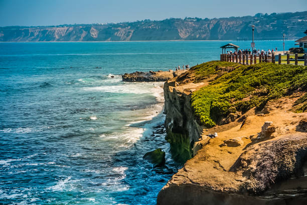 The Coastline of La Jolla Beach near San Diego, California A view off the cliffs of La Jolla Cove and the Pacific Coast Highway near San Diego California la jolla stock pictures, royalty-free photos & images