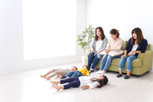 istock Smiling mothers and children image 1130155826