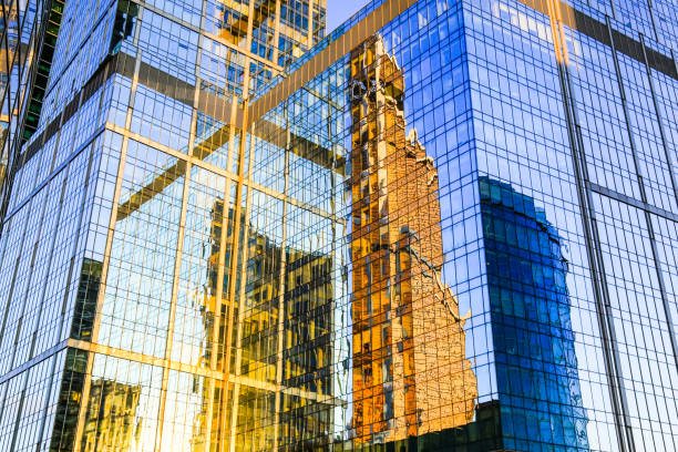 istock Mirror reflection in glass facade of skyscraper. 1130158747