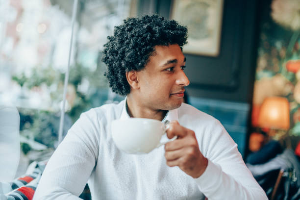 istock Afro-american man enjoying big cup of coffee 1130160697